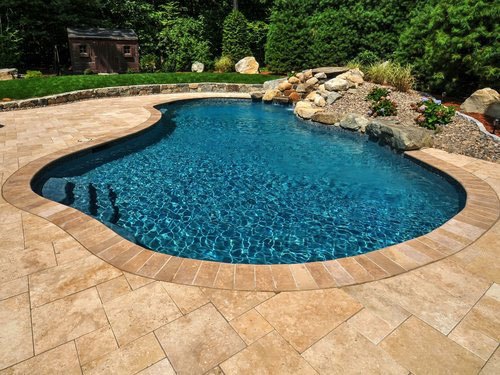 Swimming pool decking installation services. Wood, tile, & stone decking for pools in Hawaii.